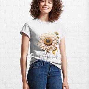 helle Sonnerblume mit französischer Unterschrift auf einem T-Shirt